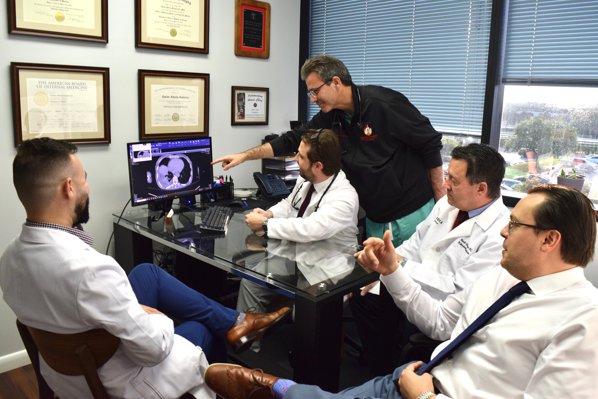 The pulmonologists of Pulmonary Associates reviewing a lung CT in our Delray Beach office